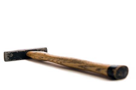 List hammer with wood handle lying on a white backgroundの写真素材