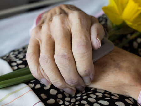 Closeup of a dead womans folded handsの写真素材