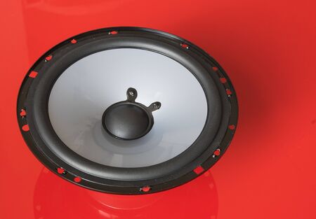 Speaker bass componenet on red backgroundの写真素材