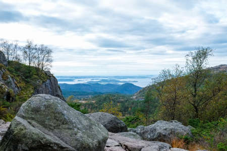 looking down a ravine filled with big granite boulders from a rockfallの写真素材