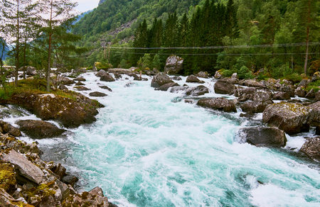 Melted water running in a river from the Folgefonna Glacier in Norwayの写真素材