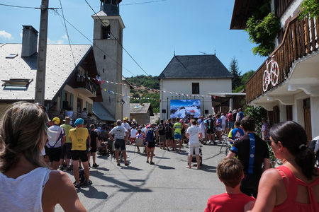 MONTVERNIER, FRANCE - JULY 23, 2015: people gathered in a small town square to watch tour de france 2015 on a big screen before the riders actually passes the townのeditorial素材