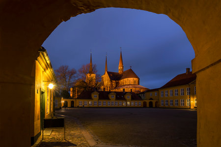 Roskilde Cathedral near Copenhagen. Constructed during the 12th and 13th centuries it on the Unesco World Heritage List. The photo is taken from the courtyard of the Bishop's houseのeditorial素材