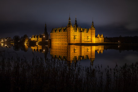 Frederiksborg Castle in Hillerod, Denmark at nightのeditorial素材