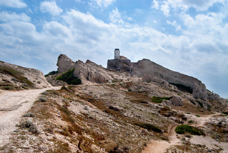 Lighthouse at the rocky coast of the Friuli Archipelagoの写真素材