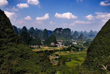 A green valley between the karst peaks in Yangshuo, Chinaの写真素材