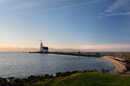 Panorama of the or Lighthouse of Marken, called Horse of Marken, translated as Horse of Marken in the morning sun on the shore of the IJsselmeer in the North of Holland.の写真素材
