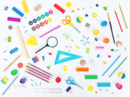 Stationery background. Bright stationery on a white background. School supplies pattern for printed products. Background with stationery on a school theme. Education conceptの写真素材