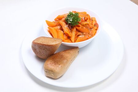 Red Sauce Pasta with Garlic Breadの写真素材