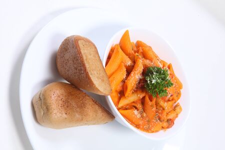 Red Sauce Pasta with Garlic Breadの写真素材