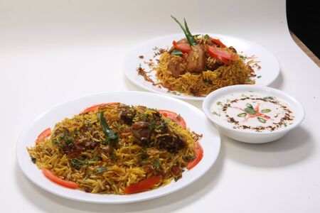 Chicken and Mutton Biryani with Raitaの写真素材