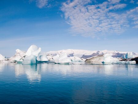 Icebergs in Iceland floating on a beautiful blue sea.