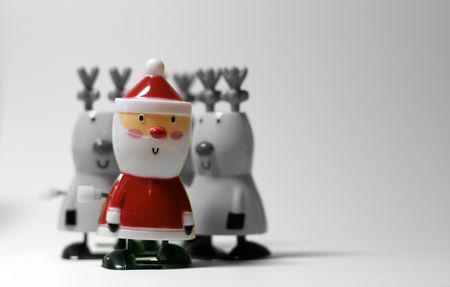 Colour Santa against a black and white background with reindeerの写真素材