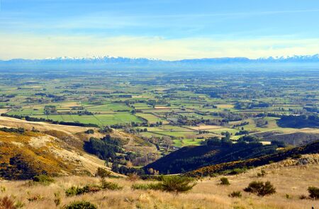 A perfect Autumn day overlooking the Canterbury plains from the top of the Port Hills  In the background are the Southern Alps  Christchurch, New Zealand の写真素材