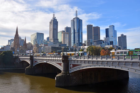 Melbourne, Australia - May 14, 2014  Melbourne city viewed from the South Bank of the Yarra River  In the foreground trams cross the St Kilda Road bridge のeditorial素材