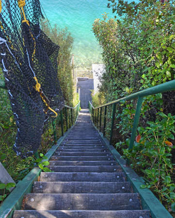 Steep wooden steps down to paradise - the treacherous route to a a batch in the Marlborough Sounds, New Zealand.の写真素材