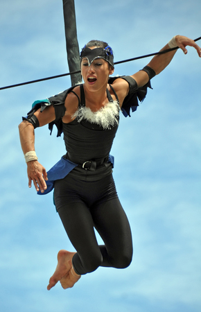 Christchurch, New Zealand - January 28, 2011: Fuse Circus aerial performer during the Campground Chaos show at the 18th World Buskers Festival.のeditorial素材