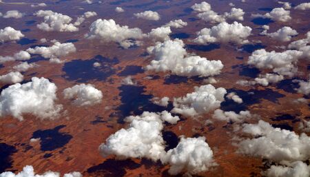 Aerial view from 35,000 feet of Tallaringa Desert and clouds pattern in South Australiaの写真素材