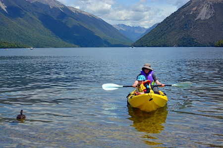Rotoiti, New Zealand - December 26, 2016:Man and child kayaking on Lake Rotoiti in Summer.のeditorial素材