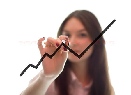 The businesswoman writes the grath on the glass  Isolated on the white background の写真素材