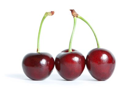 three red cherry isolated on a white background.