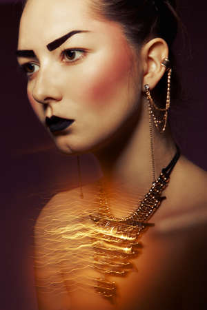 Baroque woman with Golden accessories  complex mixed light の写真素材