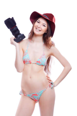 smiling woman with a professional camera isiolatedの写真素材