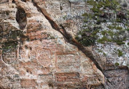 Old graffiti in the Gautmanis Cave,  sandstone rock of the Gauja river bank, Sigulda, Latviaの写真素材