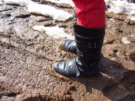 Girl in a dirty puddleの写真素材