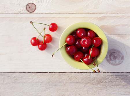 Red ripe fresh cherries close up outdoorsの写真素材