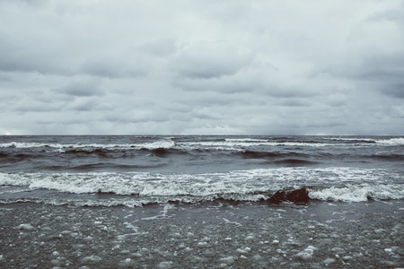 Sea water with small waves in Jurmala, Latvia. Coast of Baltic sea.の写真素材
