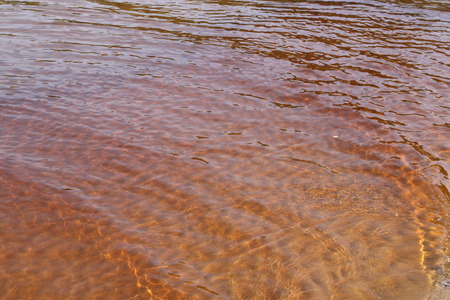 Sea water with small waves in Jurmala, Latvia. Coast of Baltic sea.