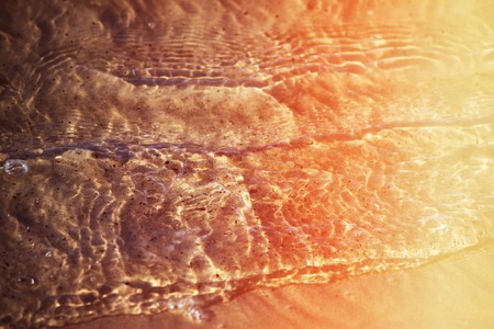 Sea water and sand surface in Latvia, White Dune, Saulkrasti.の写真素材