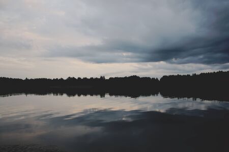 Lake in Latvia. Water surface with small waves in a windy day.