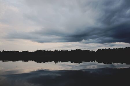 Lake in Latvia. Water surface with small waves in a windy day.の写真素材