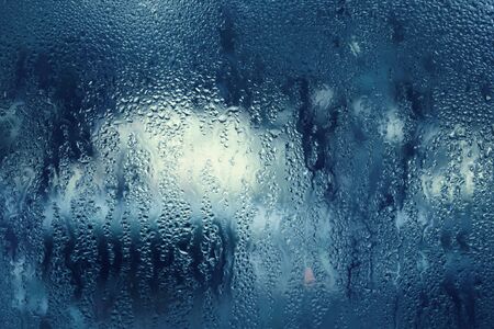 Rain drops on a window glass surface