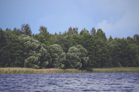 Lake in Latvia. Water surface with small waves in a windy day.の写真素材