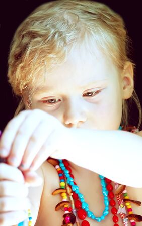 A portrait of a little blonde adorable girlの写真素材