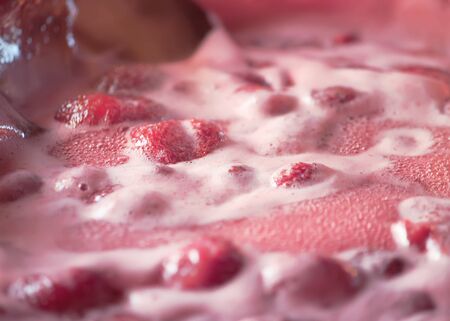 Cooking process of homemade strawberry jam.