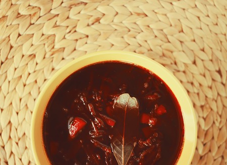 Traditional russian and ucrainian red borscht or beetroot soup with sour cream.