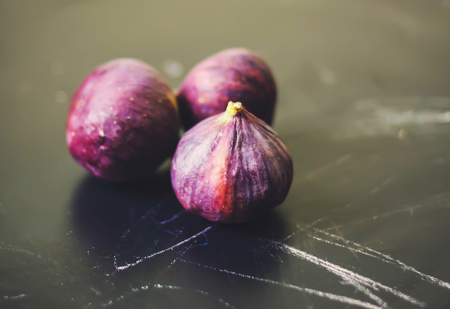 Fresh sweet ripe figs on dark background.の写真素材
