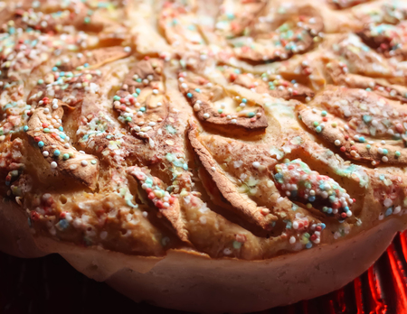 Homemade sweet apple pie with sugar decor close up.
