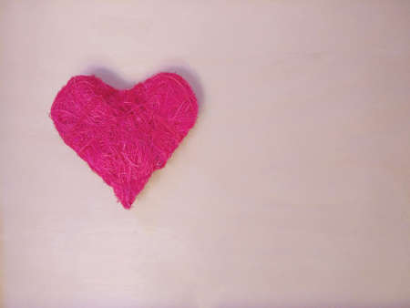 Colorful heart on wooden light background.の写真素材