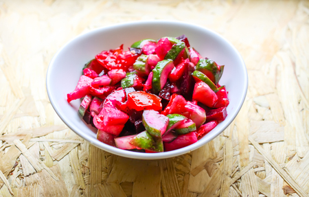 Beet and cucumber salad vinaigrette in a cupの写真素材