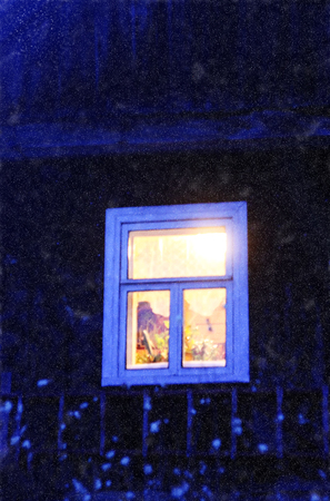 Wooden window of country house. Evening in the countryside.の写真素材