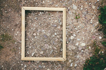 Empty picture or photo frame on stone rough texture.の写真素材