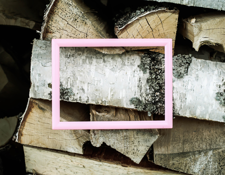 Empty picture or photo frame on birch firewoodの写真素材