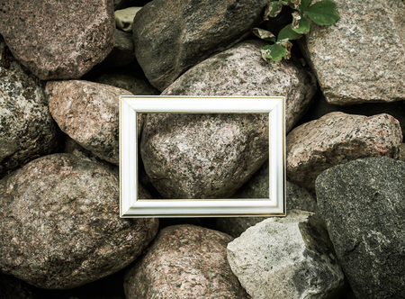 Empty picture or photo frame on rough stone background.の写真素材