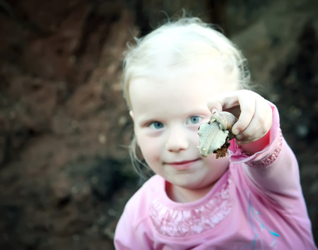Girl and snailの写真素材