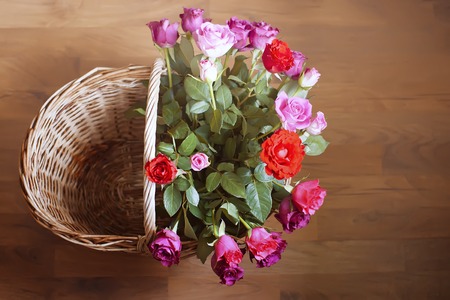 Beautiful bouquet of roses in a wicker basket.の写真素材